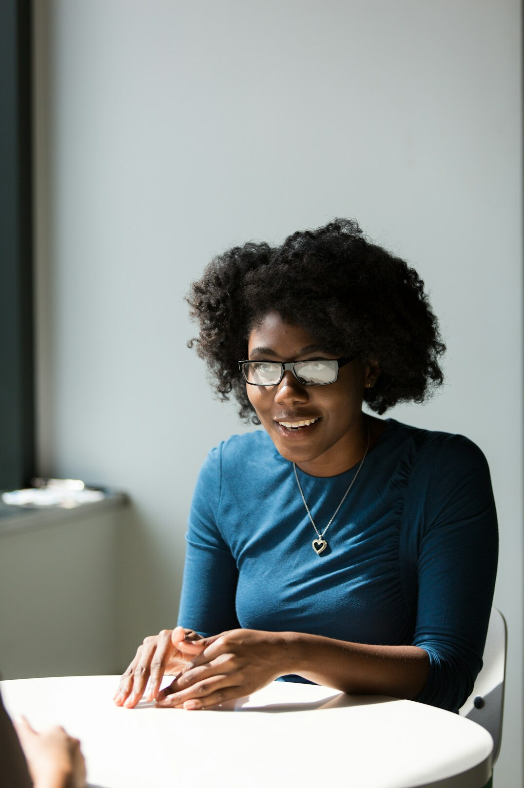 person smiling during conversation