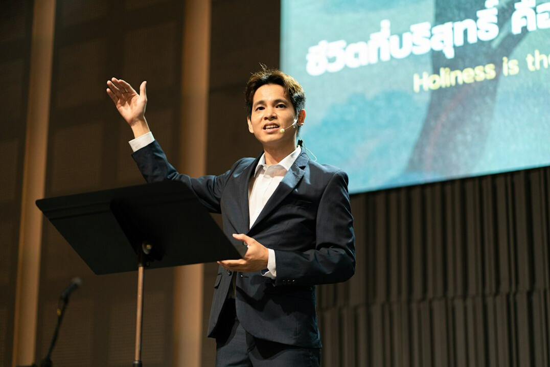 person speaking confidently on stage
