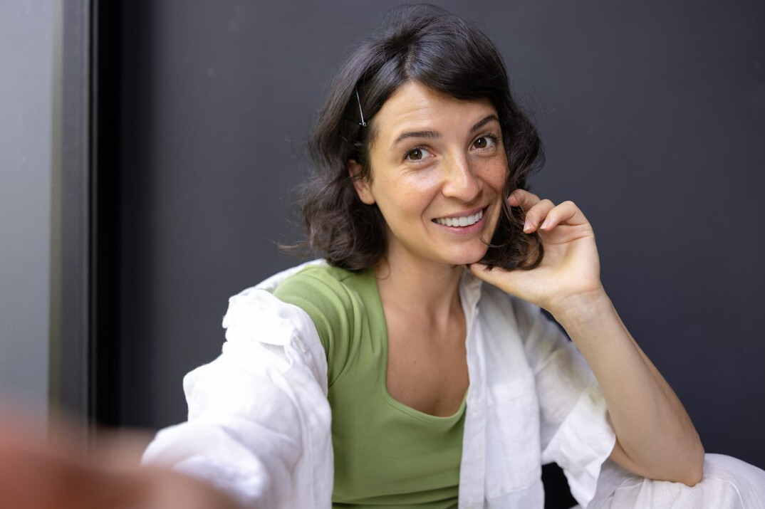 person smiling during conversation