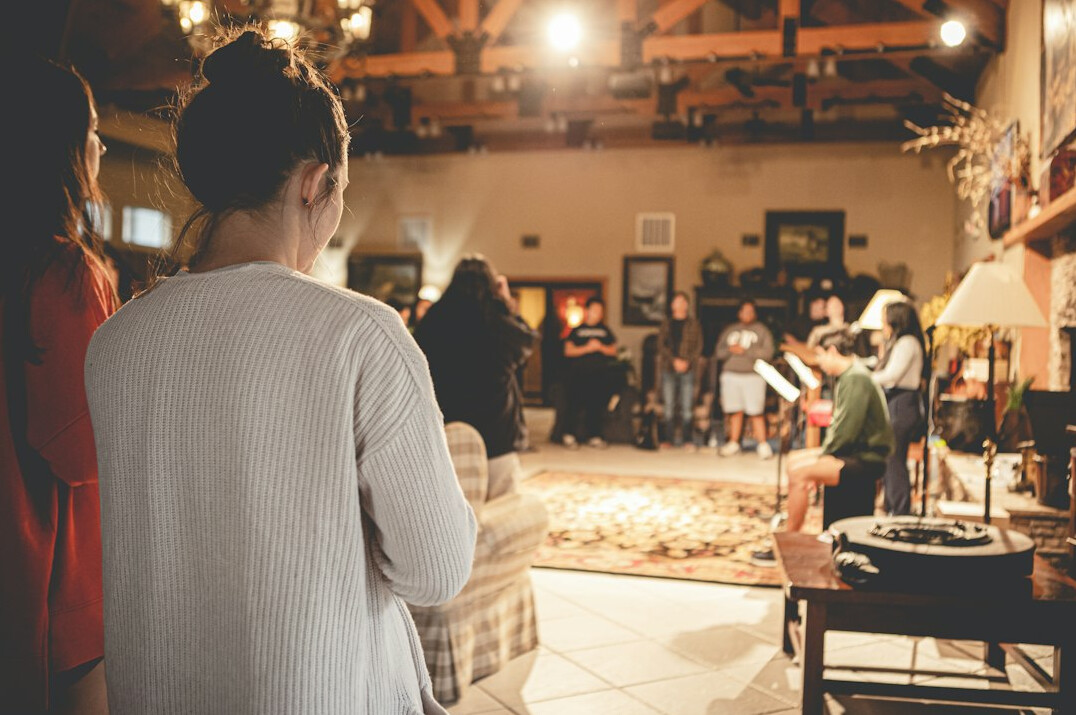 woman presenting to small group