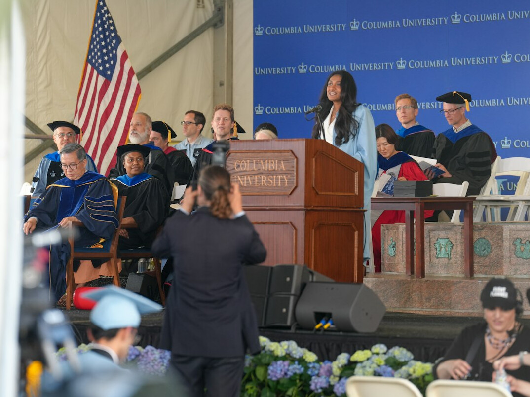 man speaking confidently at podium